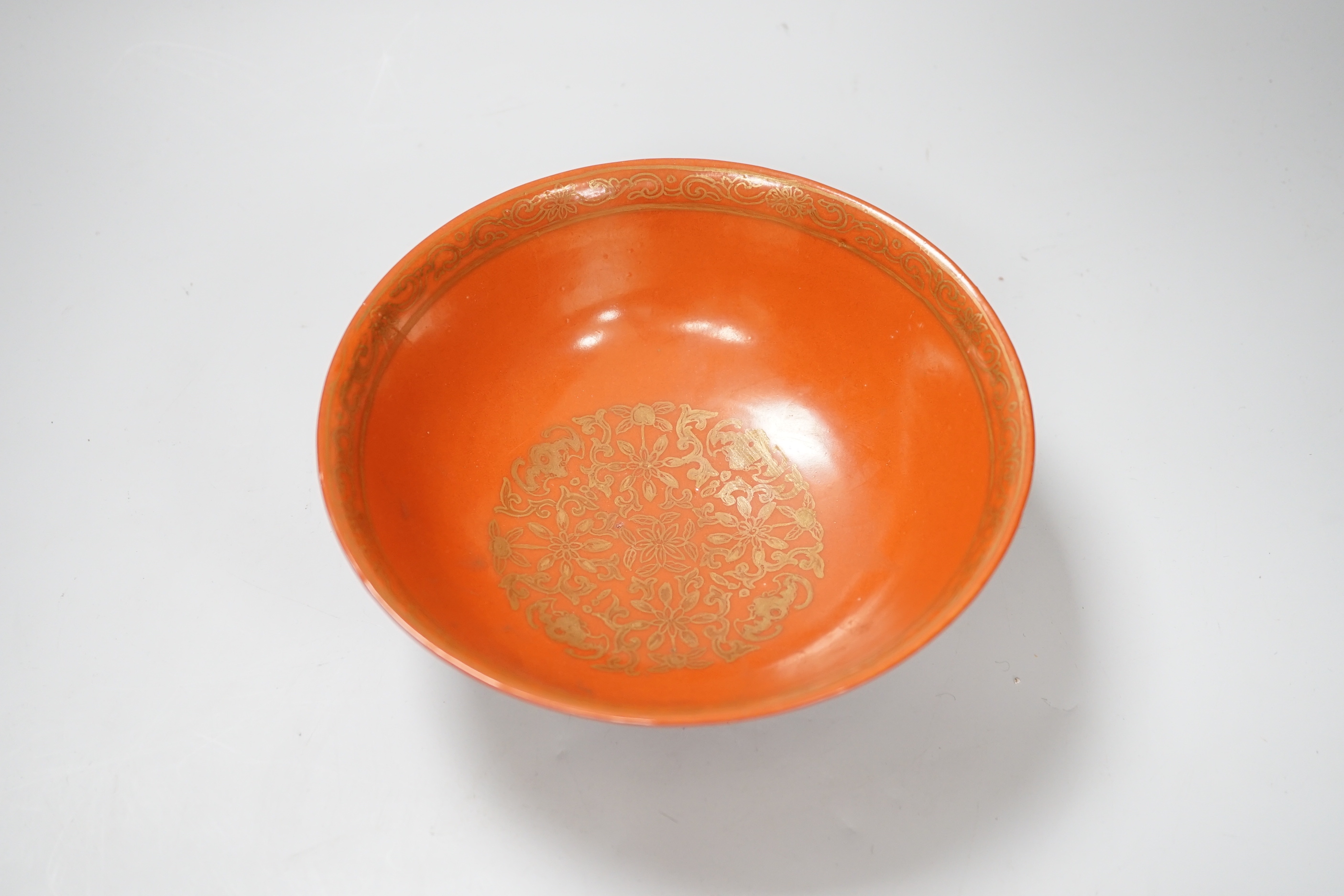 A Chinese gilded coral-ground bowl, 17cm diameter